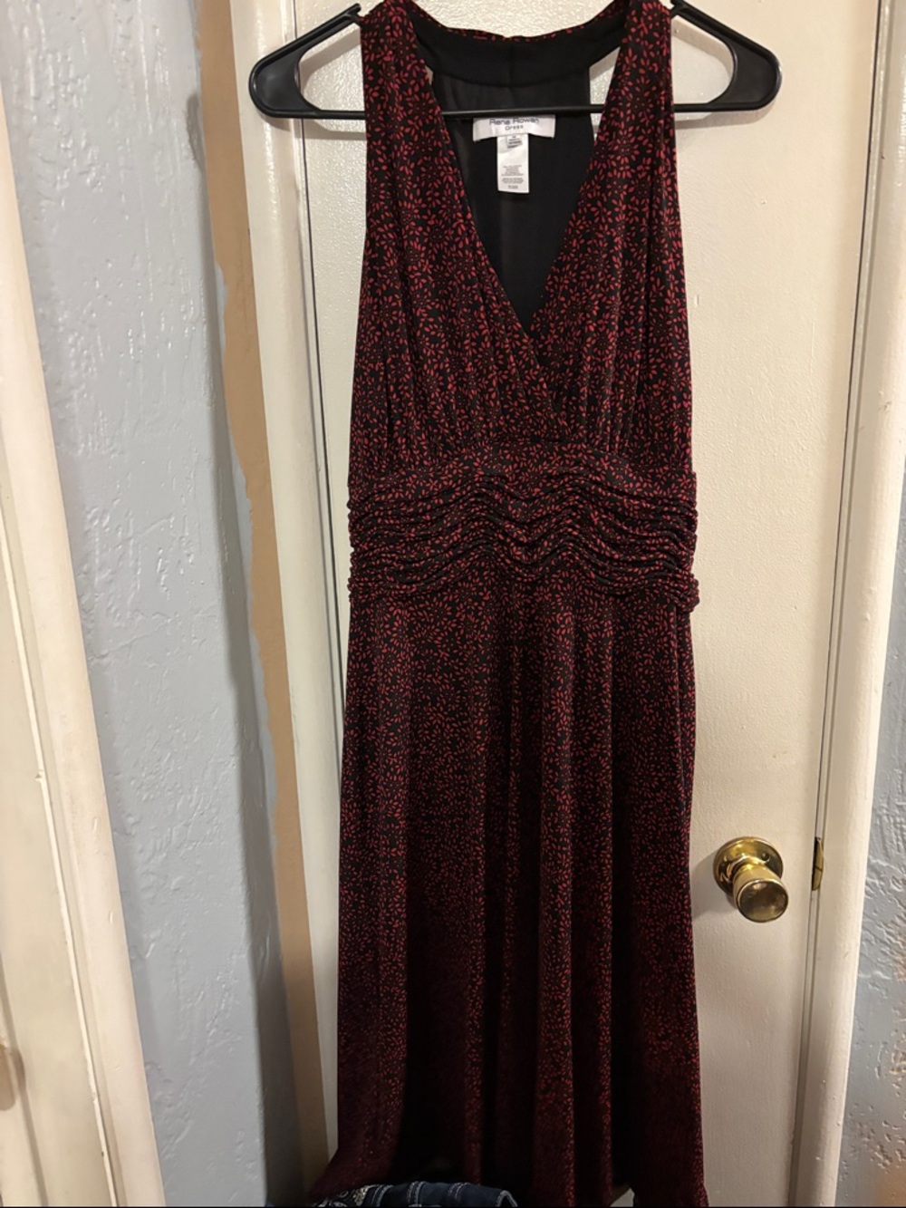 Rena Rowan Sleeveless V-Neck Midi Dress in Deep Red with Black background